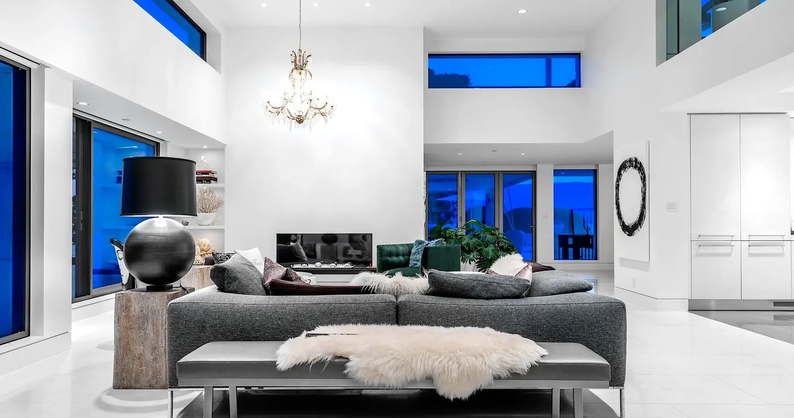 An open-concept West Vancouver interior with a double-height ceiling, clerestory windows and a modern living area.