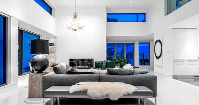 An open-concept West Vancouver interior with a double-height ceiling, clerestory windows and a modern living area.